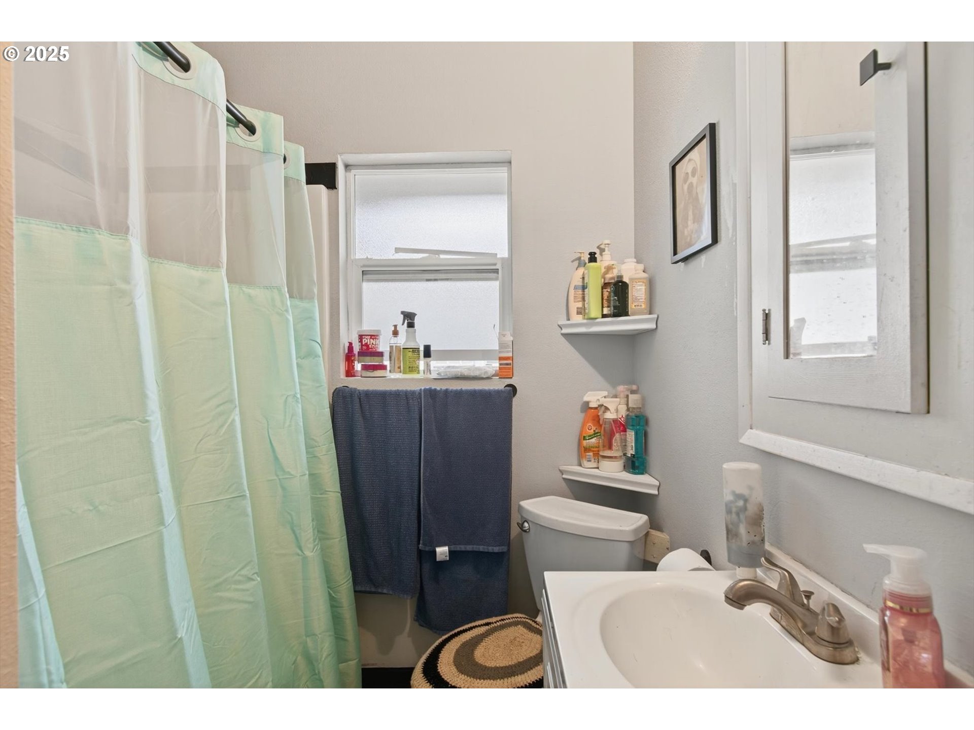 1202 3rd Avenue South Kelso, WA 98626 - Photo 16 of 28 a bathroom with a sink and a mirror