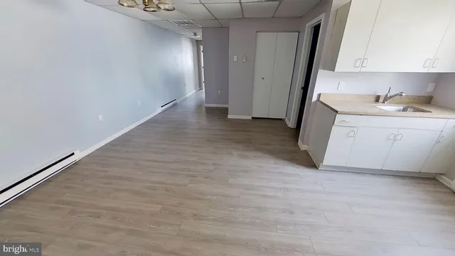 a view of hallway with cabinets