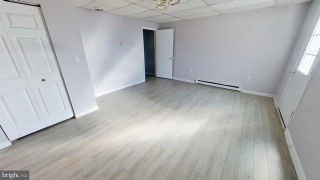 a view of hallway with wooden floor