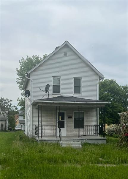 810 Spruce Avenue Sharon, PA 16146 - Photo 1 of 1 a view of a white house with a small yard and plants