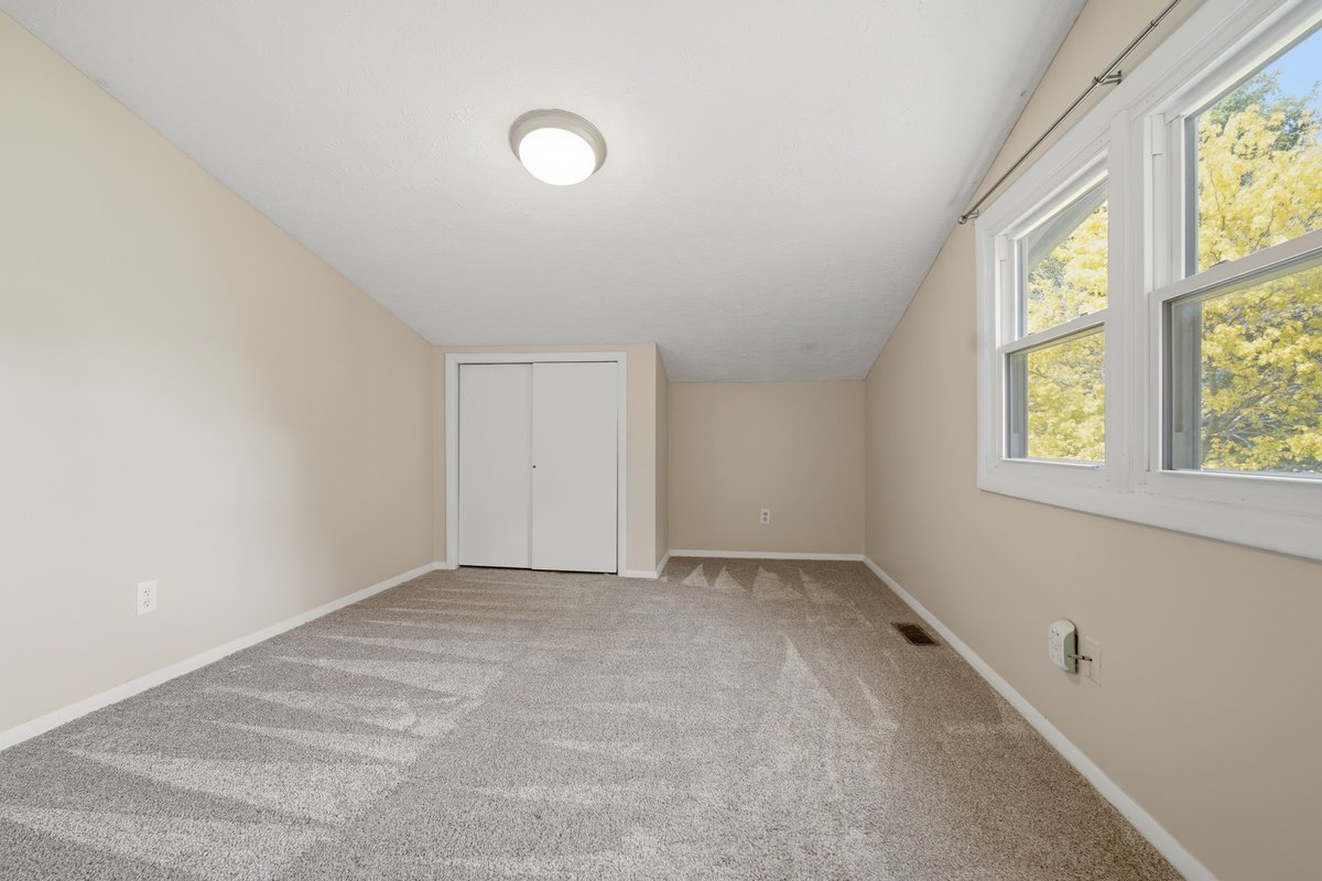 1532 Hunt Drive, Unit A Normal, IL 61761 - Photo 16 of 25 an empty room with windows
