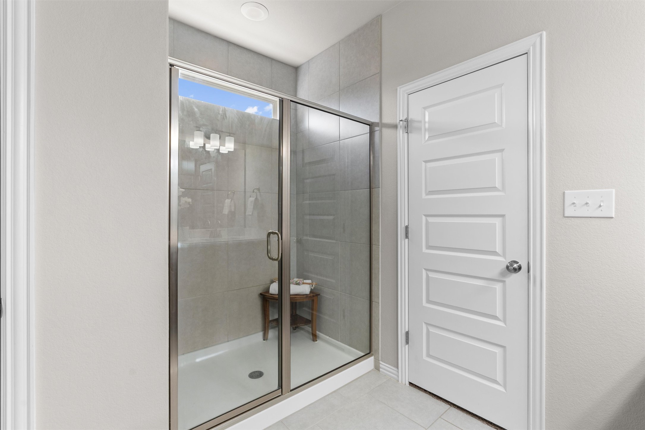 4216 Mercer Road Georgetown, TX 78628 - Photo 16 of 40 Bathroom featuring a shower stall and light tile patterned flooring