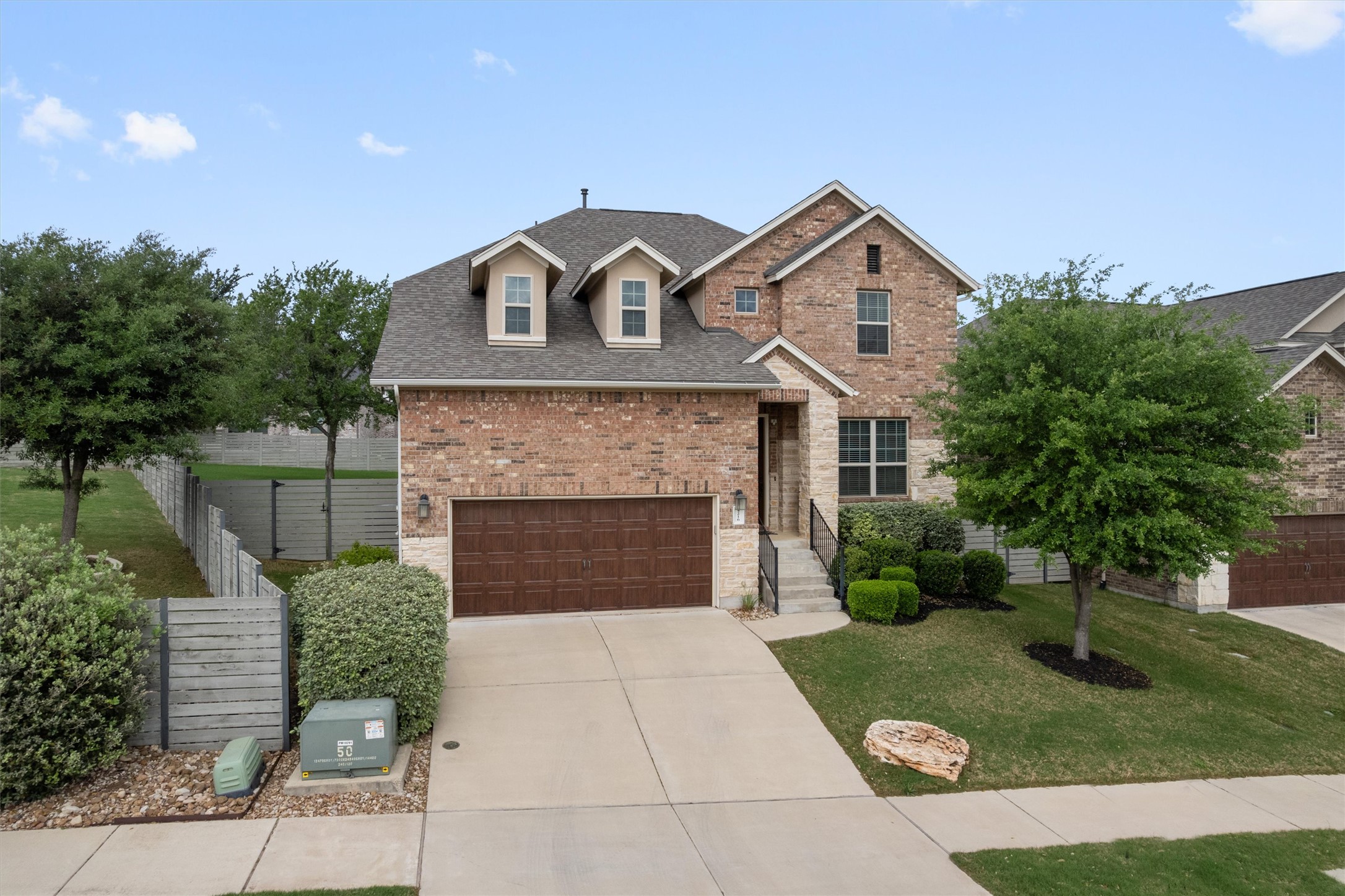 4216 Mercer Road Georgetown, TX 78628 - Photo 2 of 40 View of front of property with brick siding, roof with shingles, driveway, and an attached garage