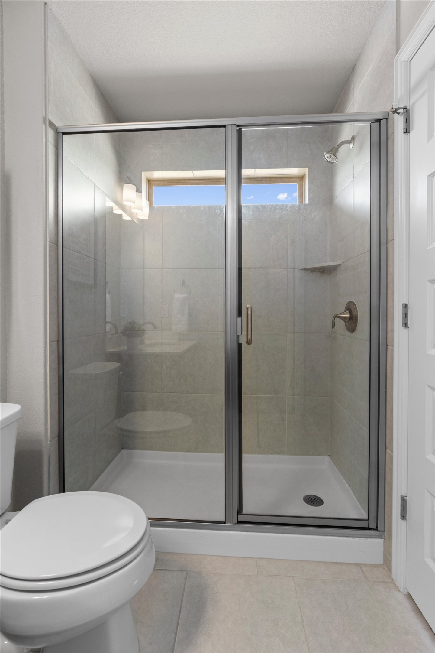 4216 Mercer Road Georgetown, TX 78628 - Photo 29 of 40 Bathroom with a shower stall, light tile floors, vanity and walk in closet