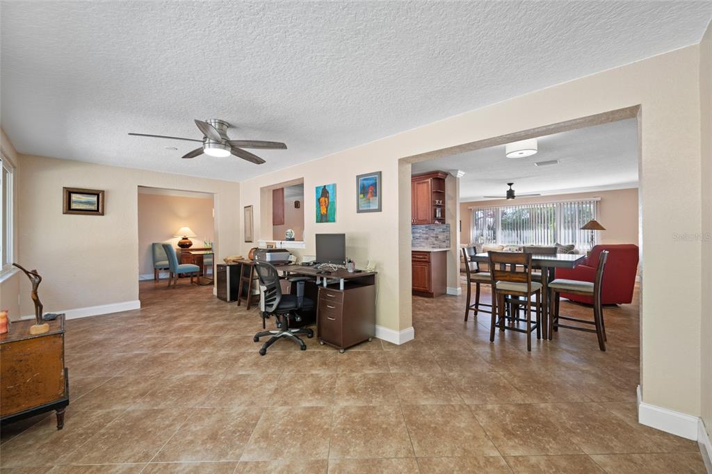 12957 90th Terrace Seminole, FL 33776 - Photo 19 of 31 a view of a dining room with furniture and a window