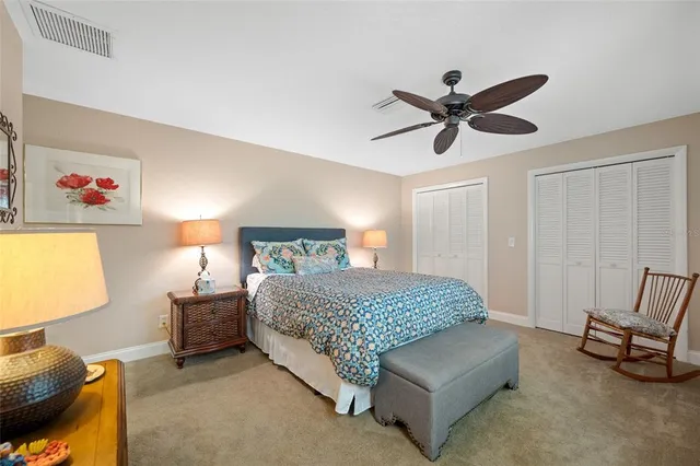 a bedroom with a bed and a couch