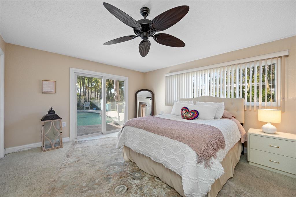 12957 90th Terrace Seminole, FL 33776 - Photo 23 of 31 a bedroom with a bed and a large window
