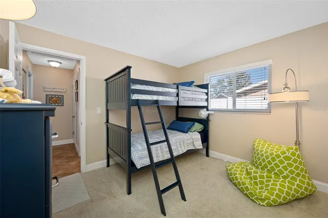 a bedroom with furniture and a window