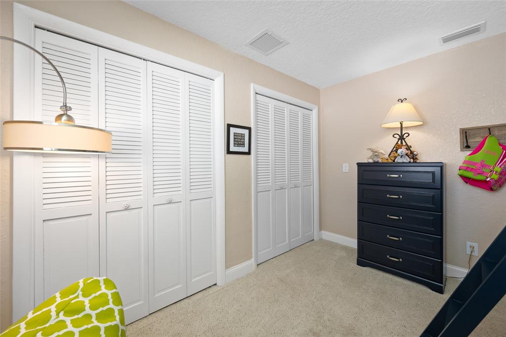 12957 90th Terrace Seminole, FL 33776 - Photo 27 of 31 a room with a dresser and a window