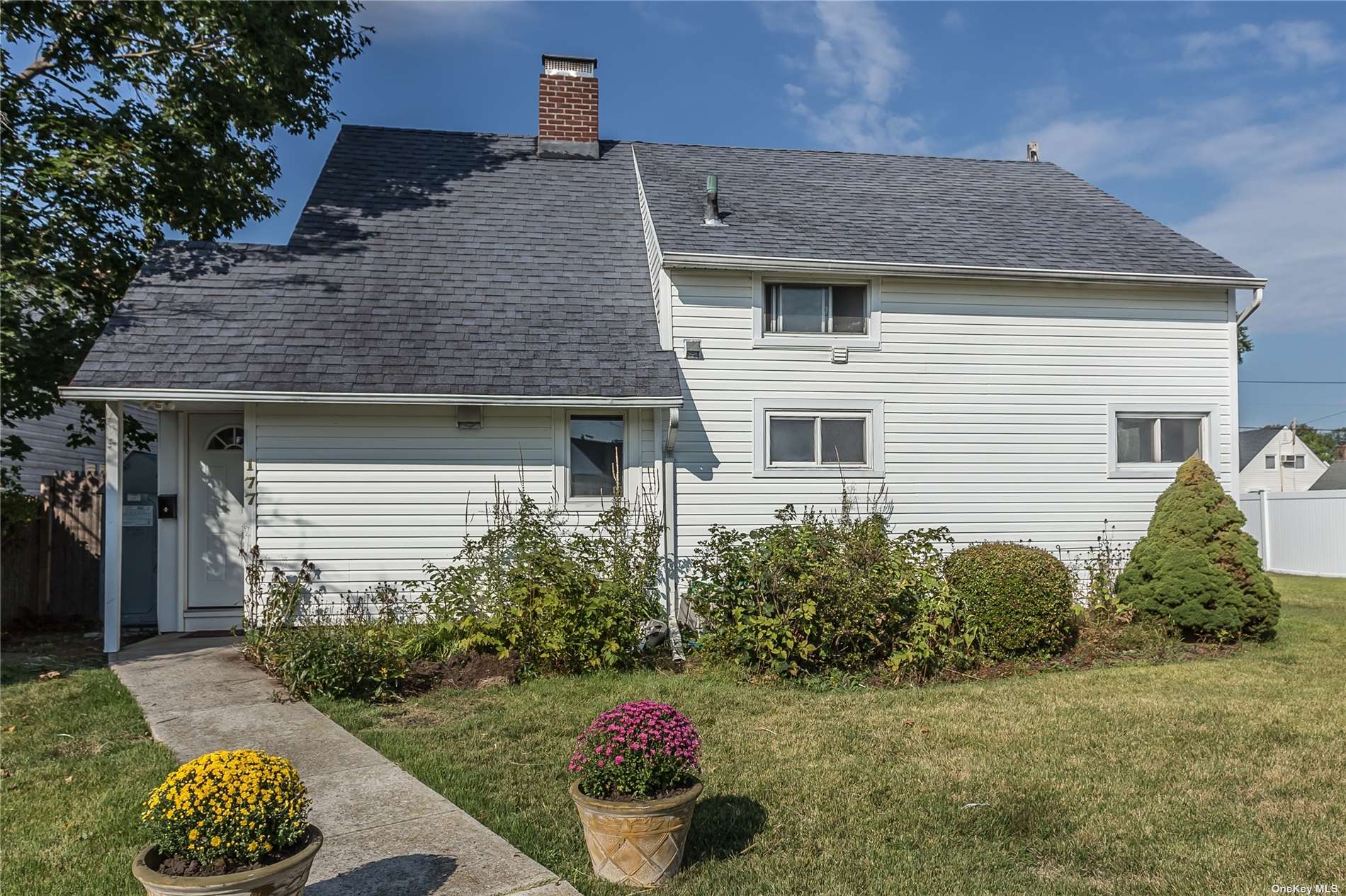 177 Meridian Road Levittown, NY 11756 - Photo 1 of 1 a front view of a house with a yard