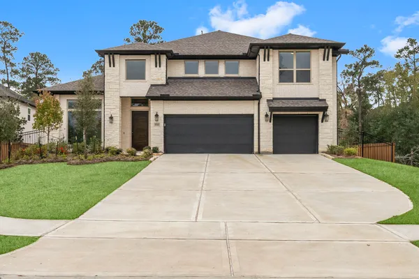 a front view of a house with yard