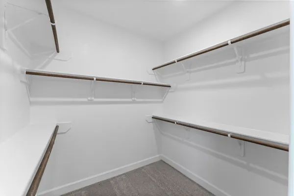 a view of an empty walk in closet