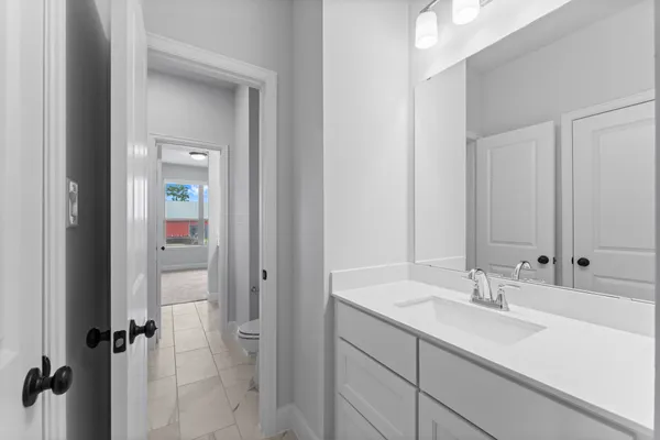 a bathroom with a sink double vanity and shower