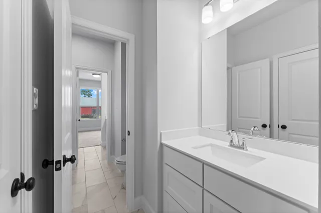 a bathroom with a sink double vanity and shower