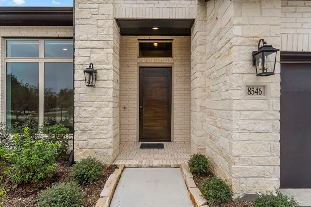 a front view of a house with a gate