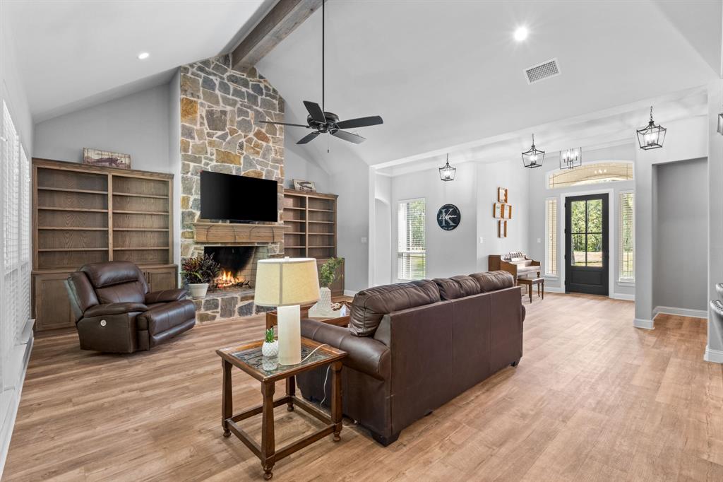 Tbd Tbd Anchor Point Quinlan, TX 75474 - Photo 7 of 40 a living room with furniture a fireplace and a flat screen tv