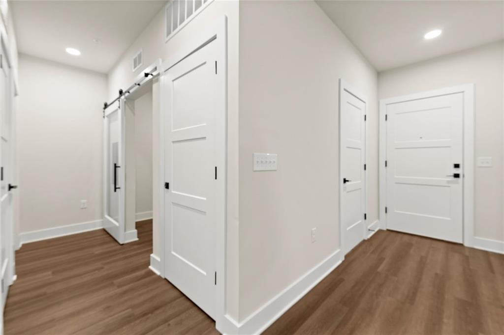 2648 Sandy Plains Road, Unit 422 Marietta, GA 30066 - Photo 5 of 37 a view of empty room with wooden floor