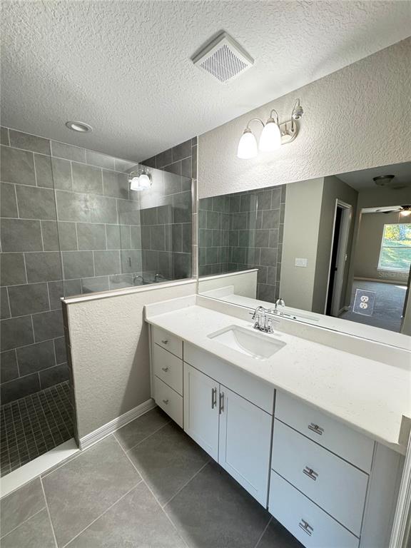 19330 Southwest 91st Loop Dunnellon, FL 34432 - Photo 12 of 46 a bathroom with a double vanity sink a large mirror and shower