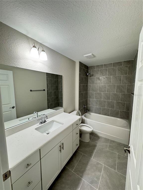 19330 Southwest 91st Loop Dunnellon, FL 34432 - Photo 14 of 46 a bathroom with a double vanity sink toilet mirror and bathtub