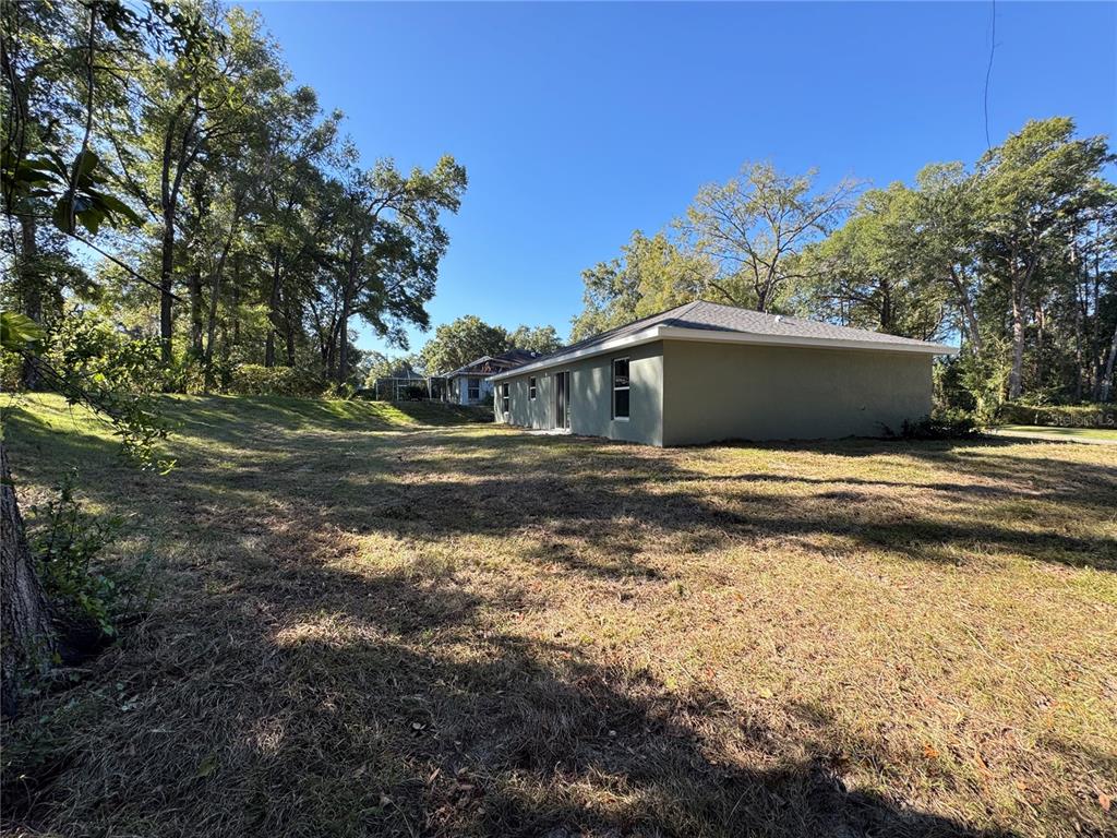 19330 Southwest 91st Loop Dunnellon, FL 34432 - Photo 16 of 46 a view of a house with a yard