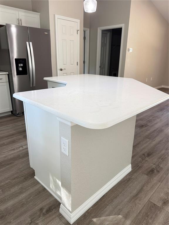 19330 Southwest 91st Loop Dunnellon, FL 34432 - Photo 9 of 46 a view of a kitchen with refrigerator and wooden floor