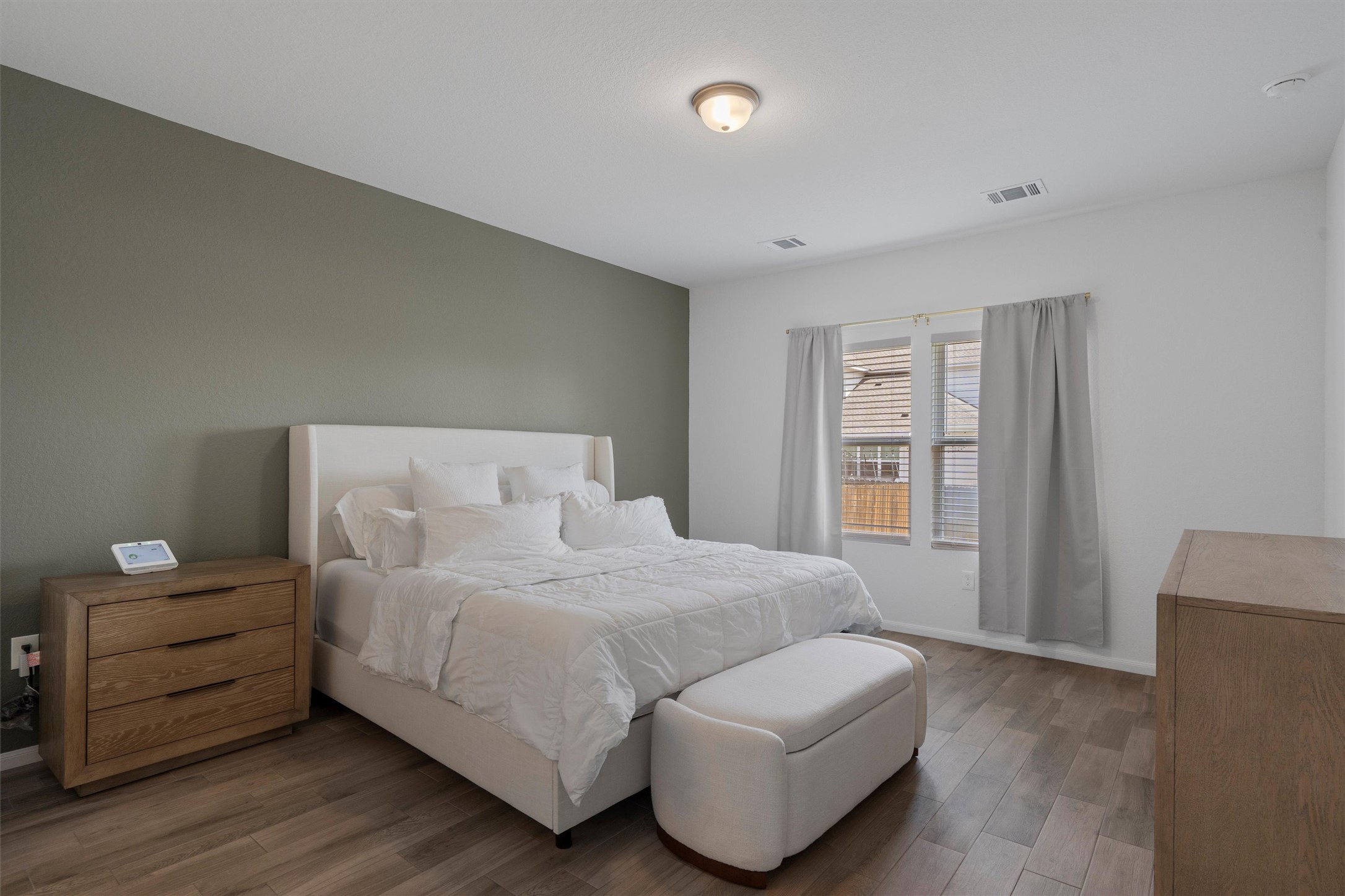 6720 Coalinga Lane Pflugerville, TX 78660 - Photo 17 of 38 a bedroom with a bed and a couch