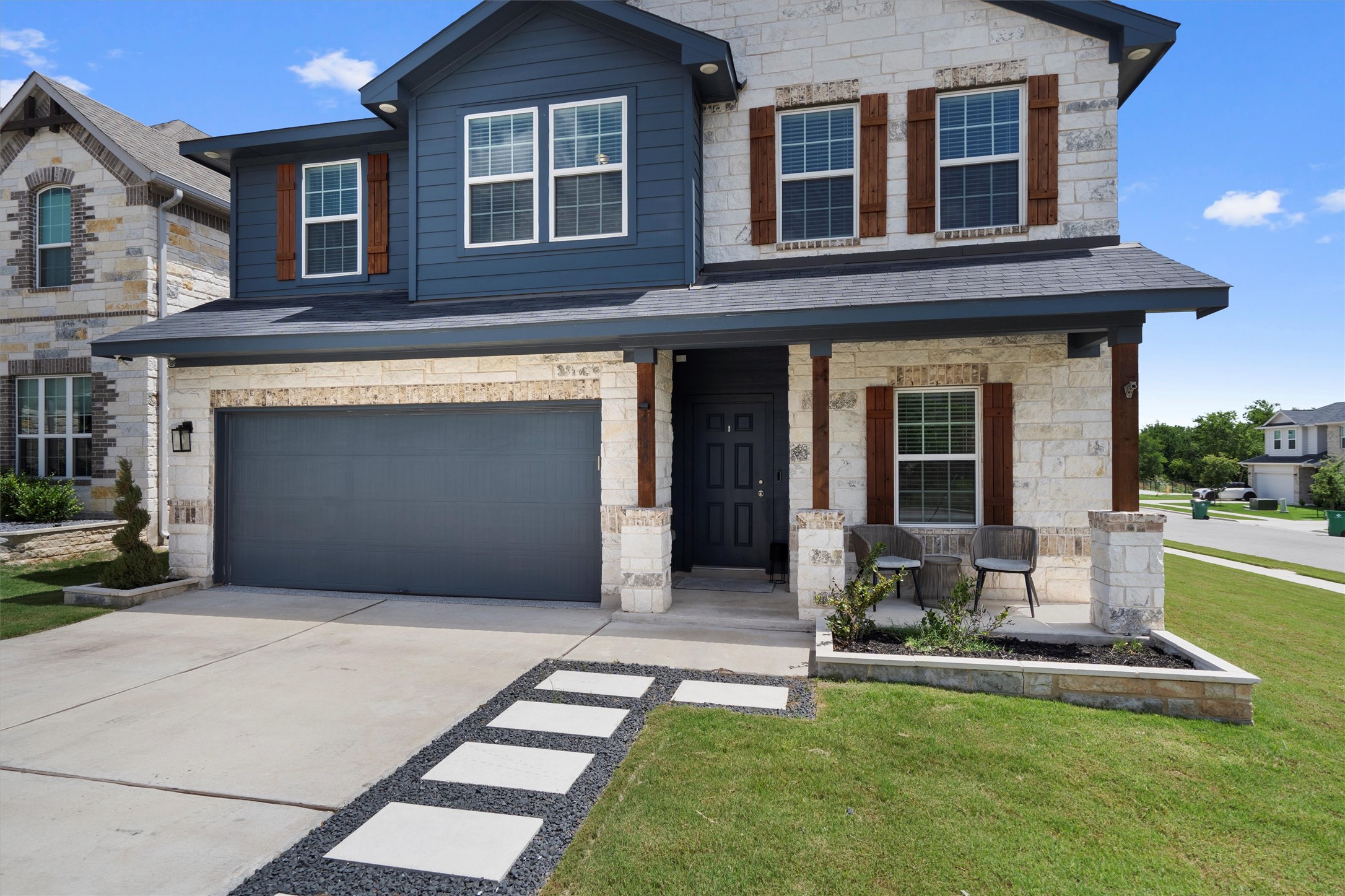 6720 Coalinga Lane Pflugerville, TX 78660 - Photo 2 of 38 a front view of a house with a yard table and chairs