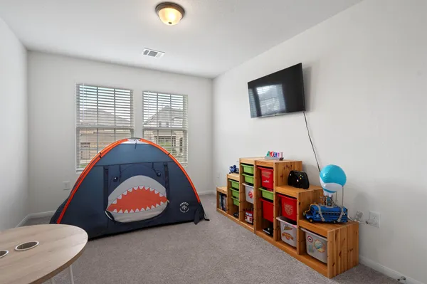 a room with toys and a flat screen tv