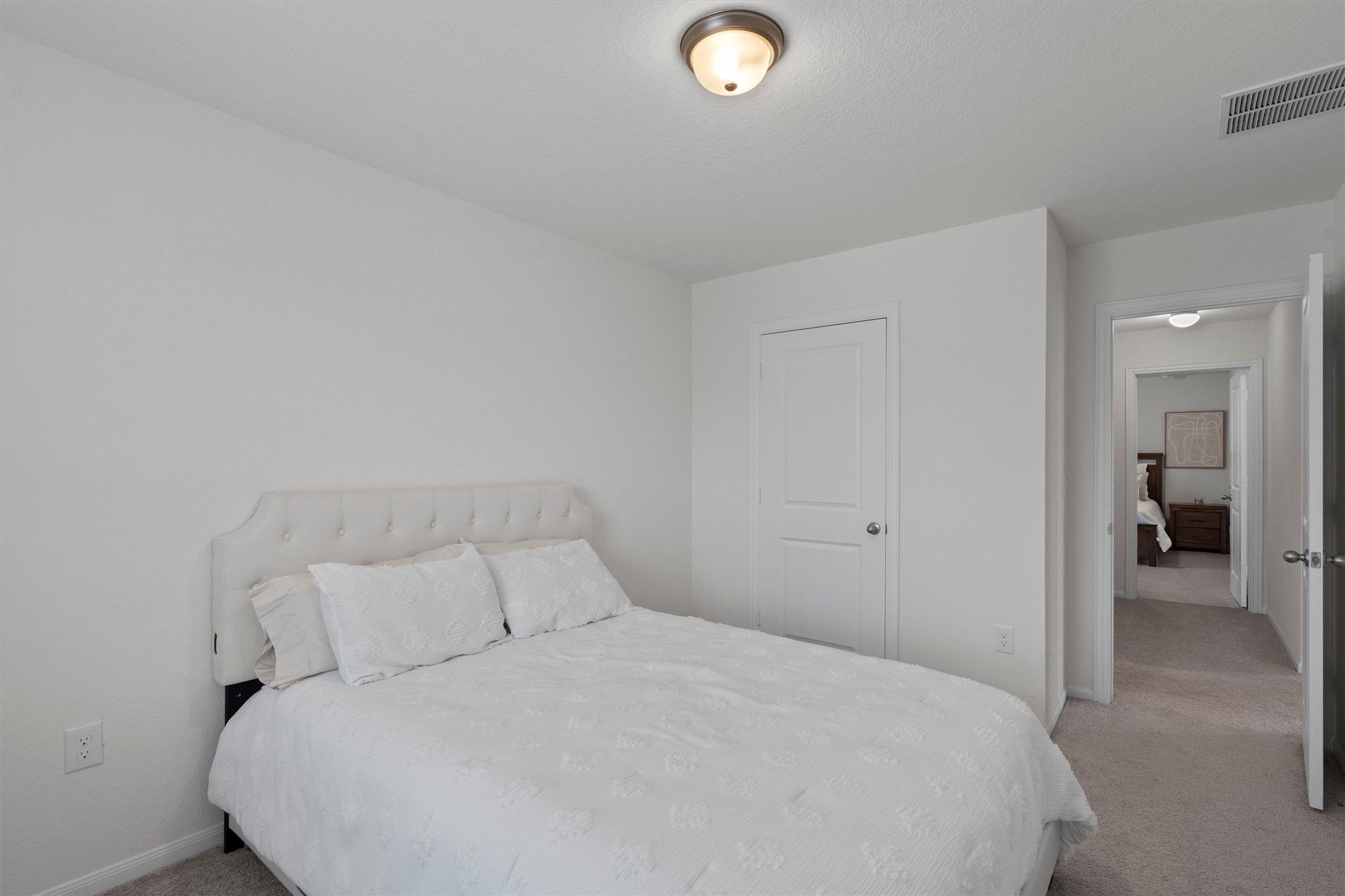 6720 Coalinga Lane Pflugerville, TX 78660 - Photo 30 of 38 a large bed sitting in a bedroom and closet