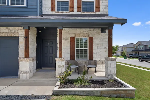 a front view of a house with garden