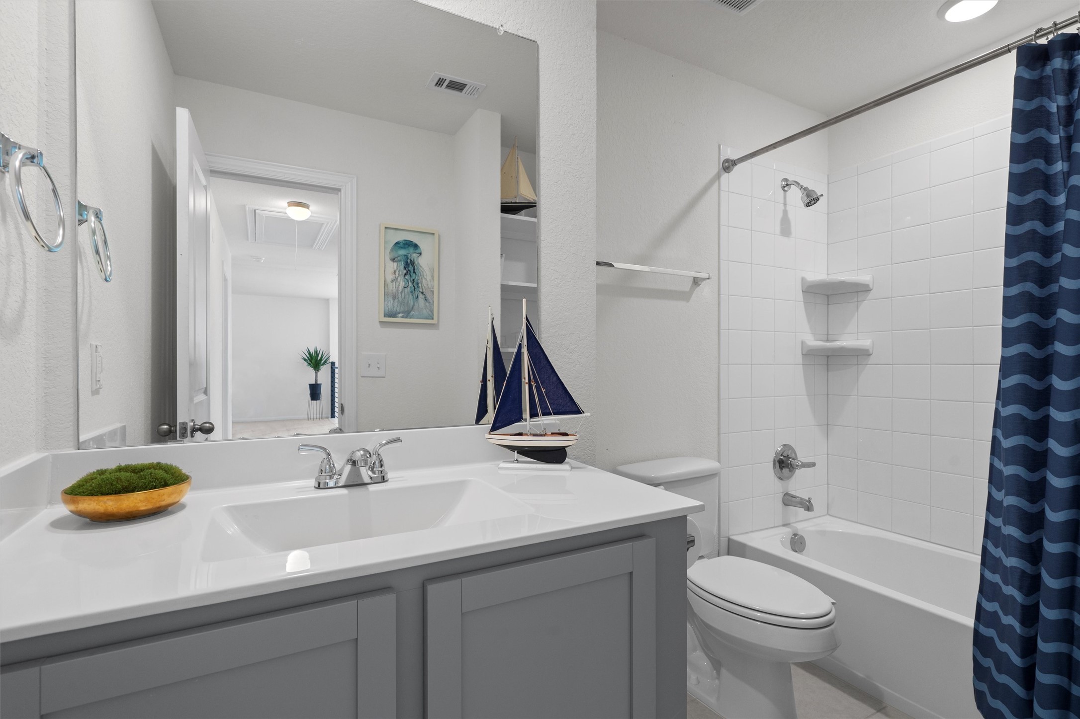 6720 Coalinga Lane Pflugerville, TX 78660 - Photo 33 of 38 a bathroom with a sink a toilet and shower