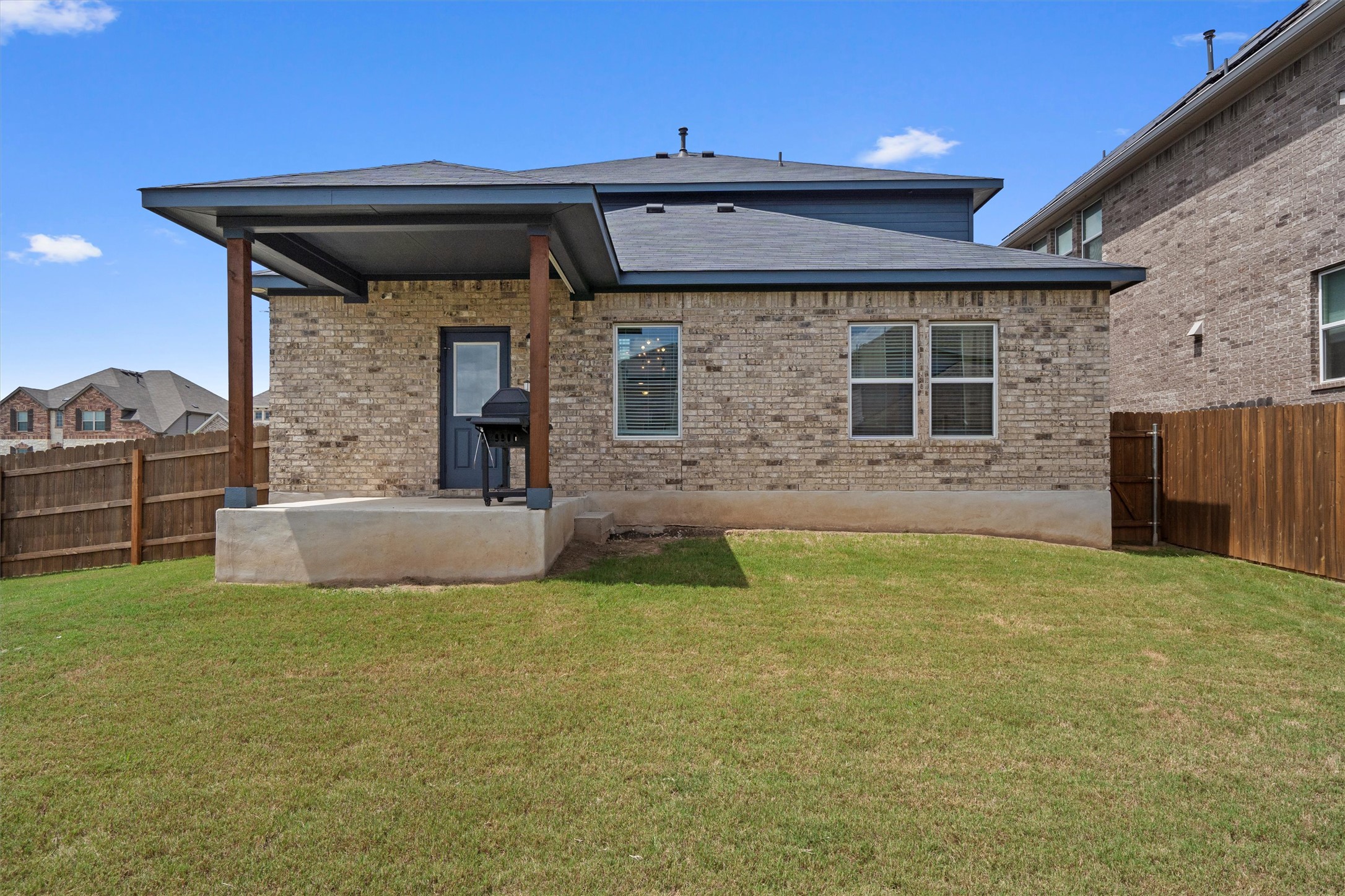 6720 Coalinga Lane Pflugerville, TX 78660 - Photo 34 of 38 a view of a house with a back yard