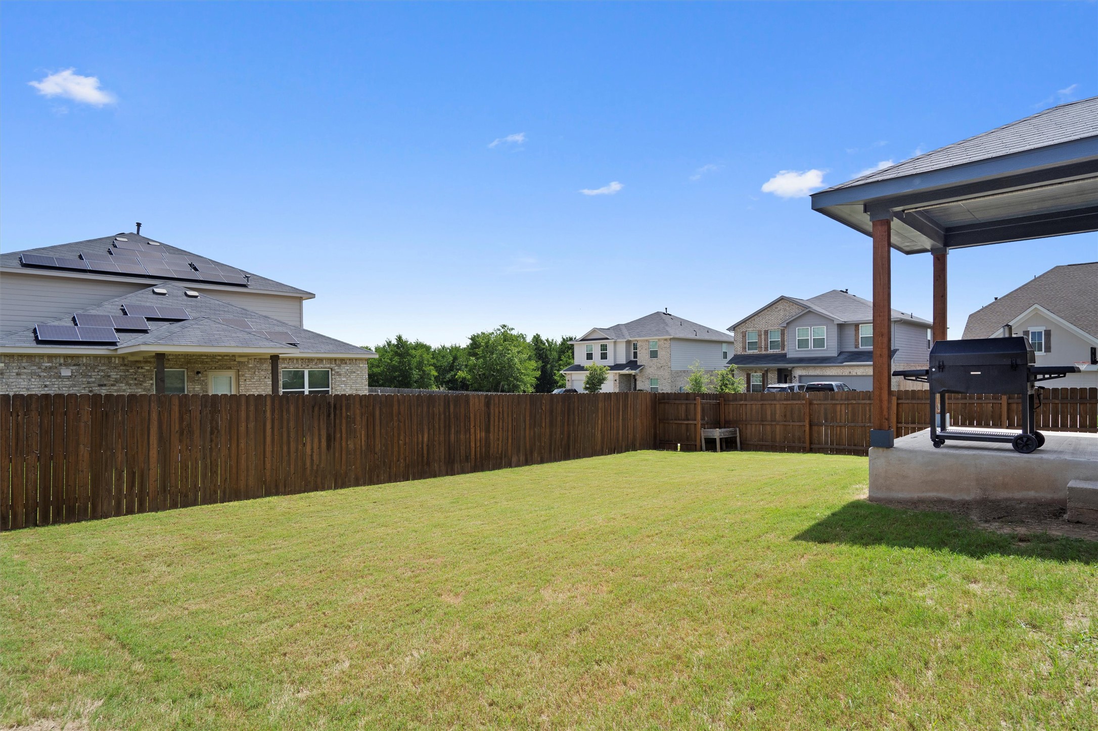 6720 Coalinga Lane Pflugerville, TX 78660 - Photo 38 of 38 a swimming pool with some trees in the background