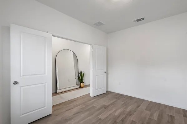 a view of a hardwood & utility room