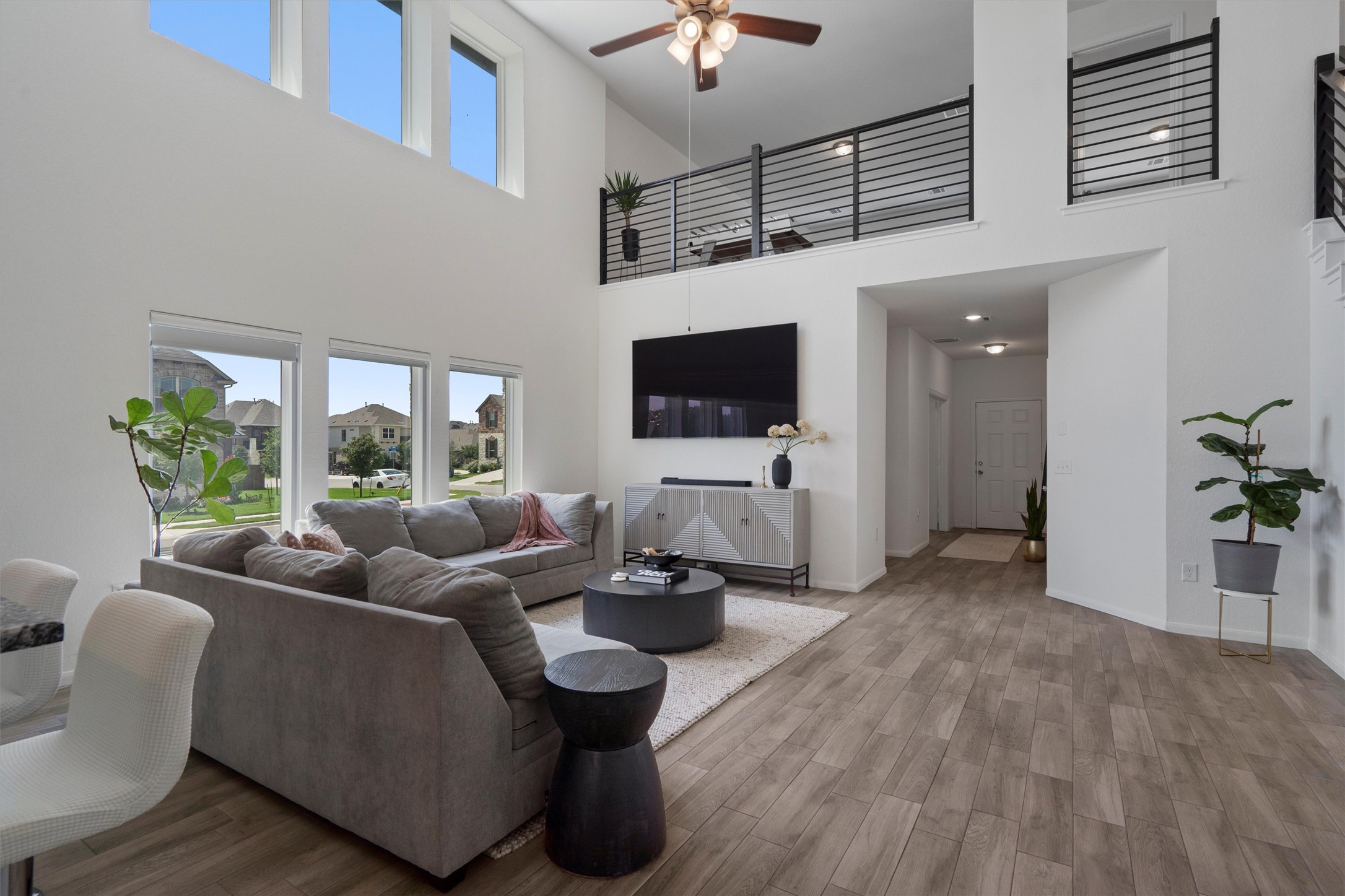 6720 Coalinga Lane Pflugerville, TX 78660 - Photo 7 of 38 a living room with furniture and a flat screen tv