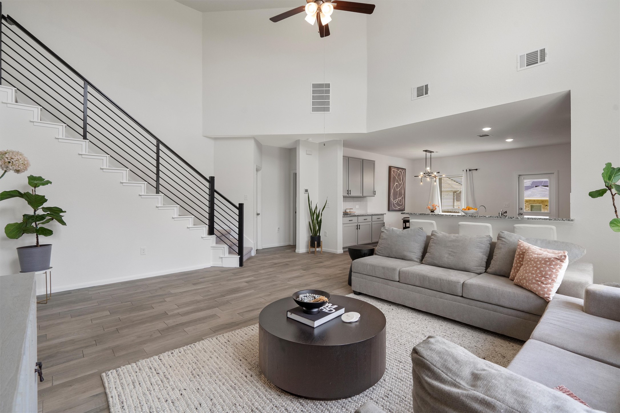 6720 Coalinga Lane Pflugerville, TX 78660 - Photo 8 of 38 a living room with furniture and a wooden floor
