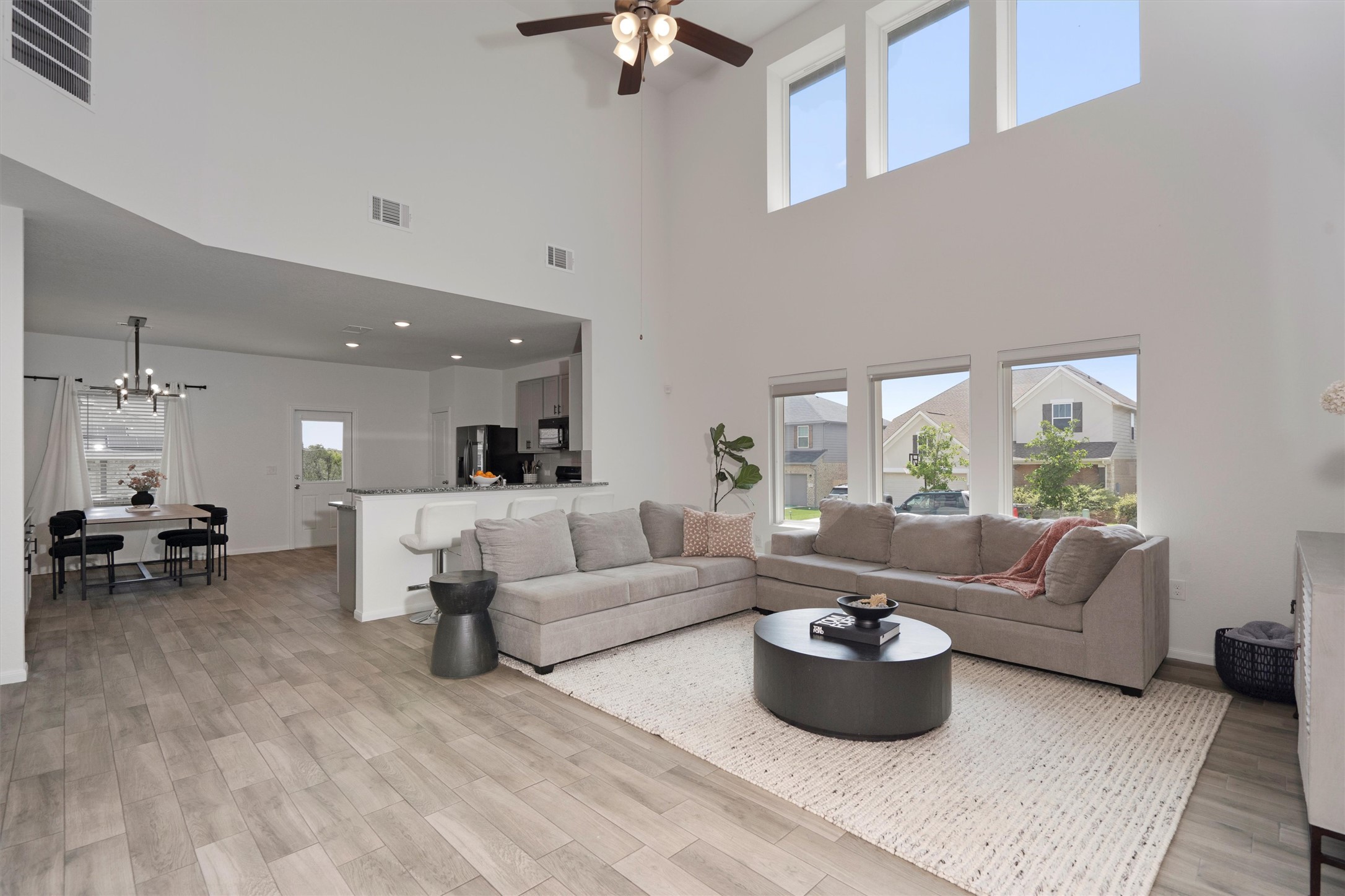 6720 Coalinga Lane Pflugerville, TX 78660 - Photo 9 of 38 a living room with furniture and a large window