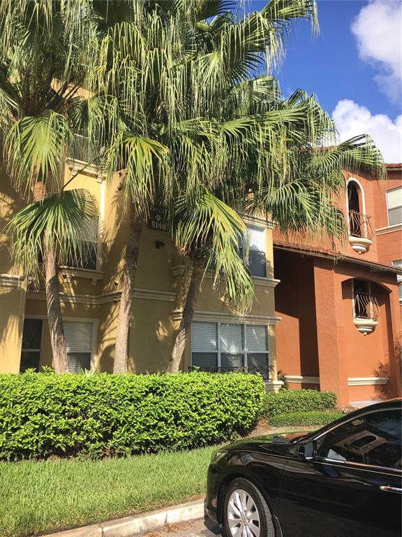 5148 Conroy Road, Unit 1214 Orlando, FL 32811 - Photo 1 of 16 front view of a house with a yard