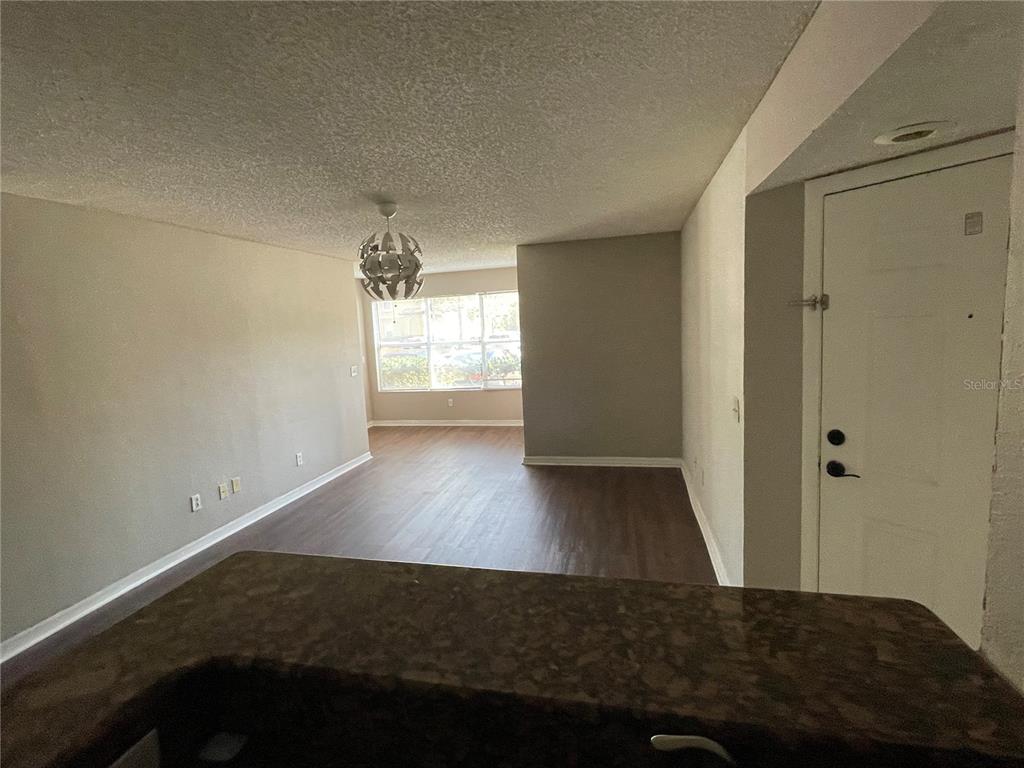 5148 Conroy Road, Unit 1214 Orlando, FL 32811 - Photo 8 of 16 a view of empty room with wooden floor