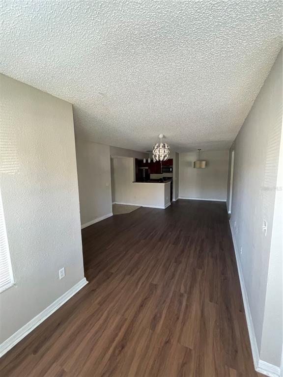 5148 Conroy Road, Unit 1214 Orlando, FL 32811 - Photo 10 of 16 a view of empty room with wooden floor