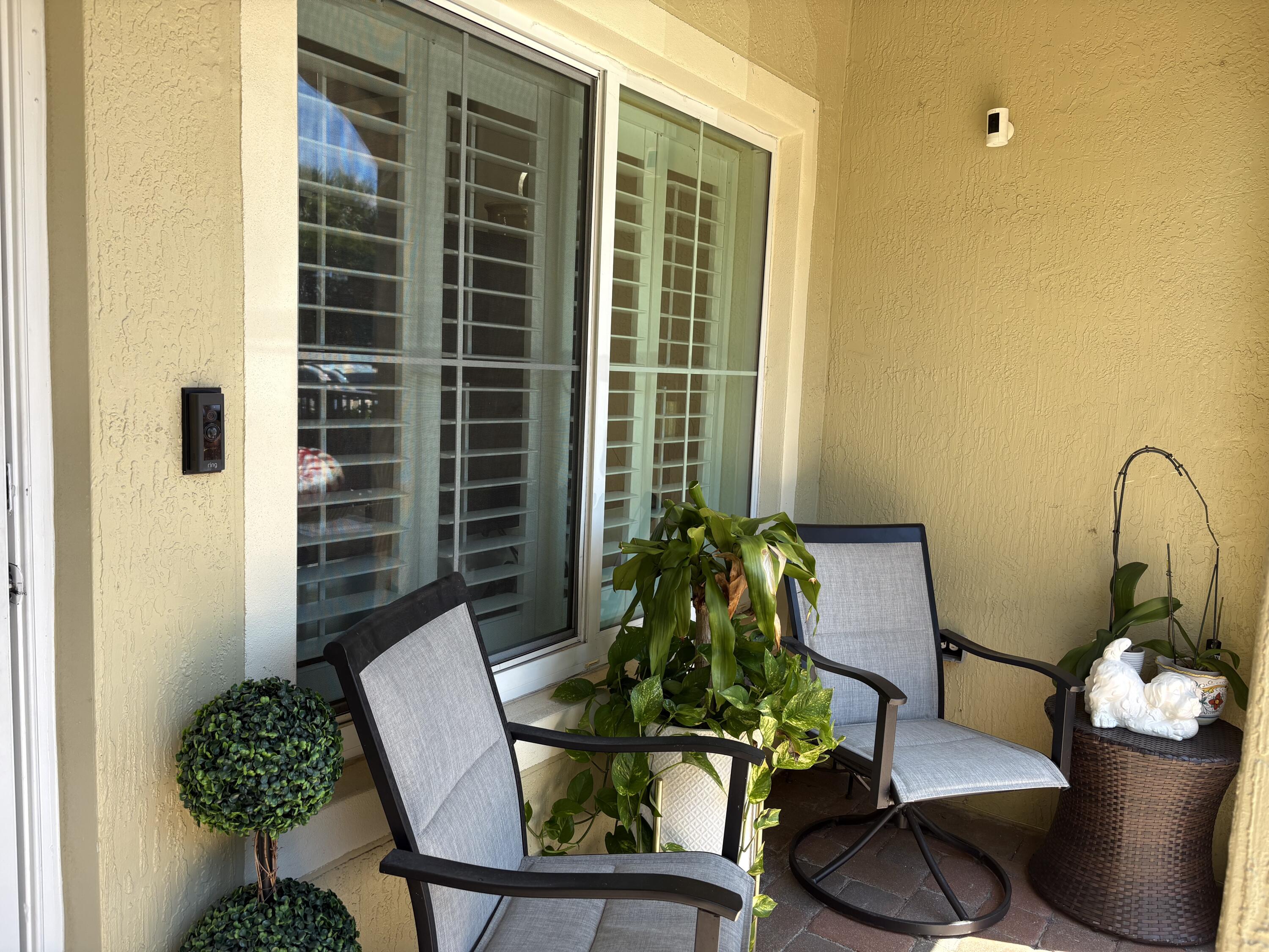 344 Lake Monterey Circle Boynton Beach, FL 33426 - Photo 2 of 14 a living room with furniture and potted plant