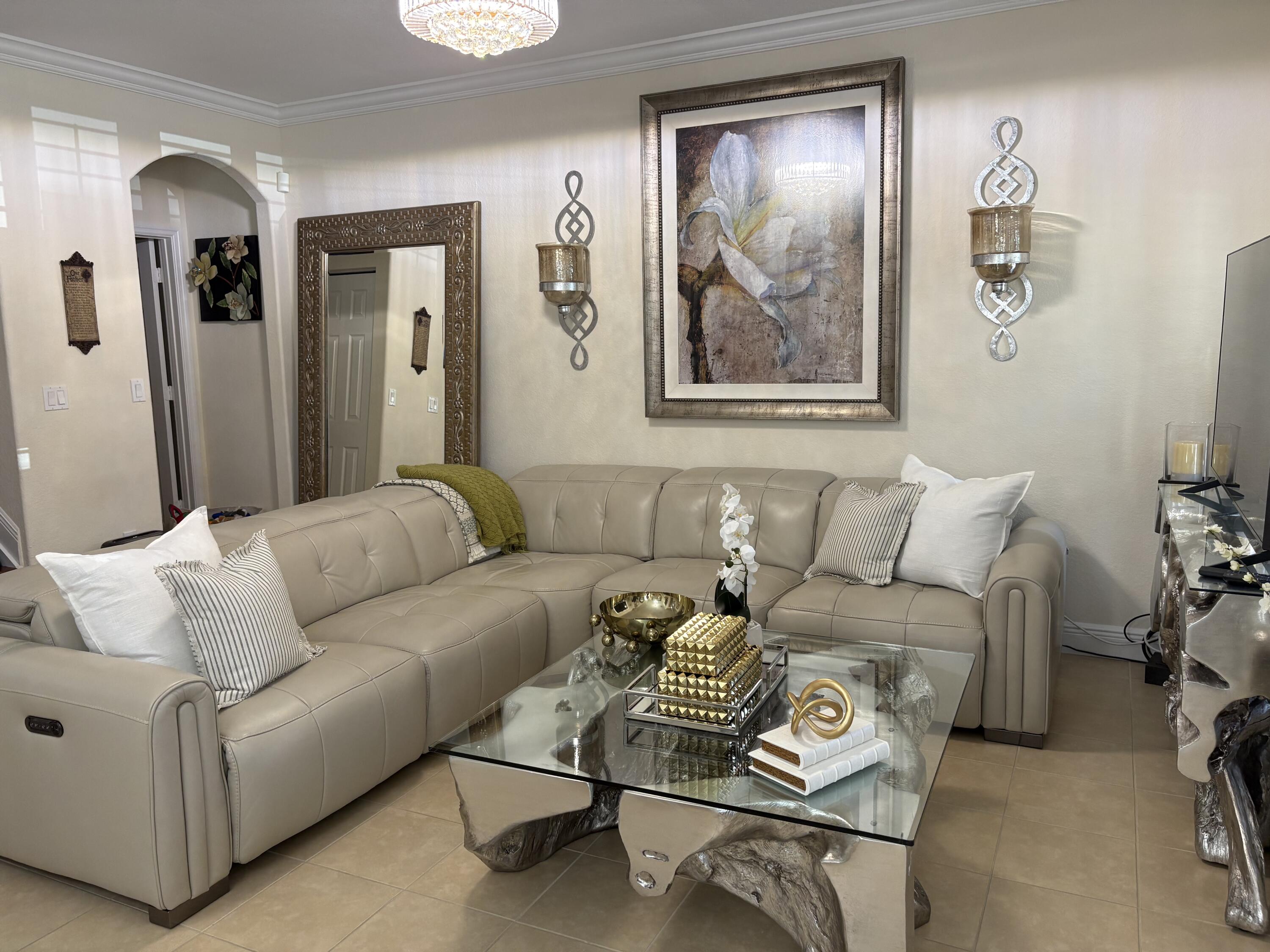 344 Lake Monterey Circle Boynton Beach, FL 33426 - Photo 3 of 14 a living room with furniture and painting on the wall