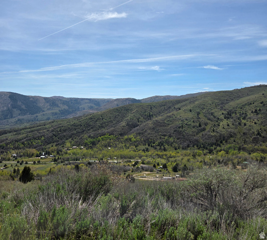 3325 North Oak Cyn Road, Unit 490 Huntsville, UT 84317 - Photo 9 of 25 Expansive mountain landscape featuring rolling hills and abundant greenery under a vast blue sky