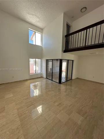 a view of an empty room with window