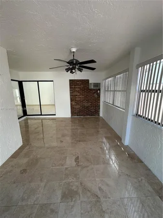 a large kitchen with a large counter top appliances and cabinets