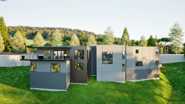 an aerial view of a house with a yard