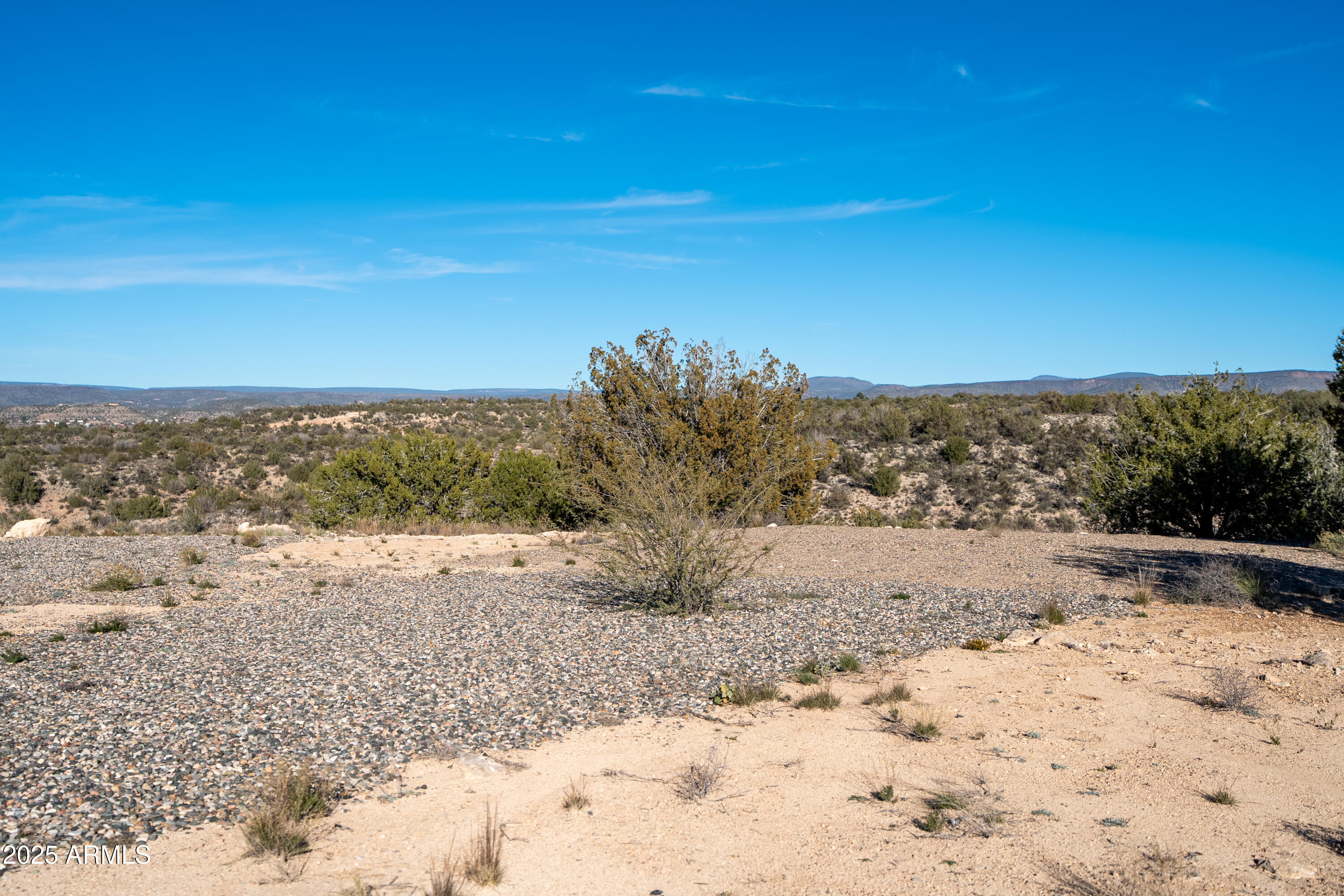3580 Kit Carson Trail Rimrock, AZ 86335 - Photo 3 of 24 a view of a dry yard with wooden fence