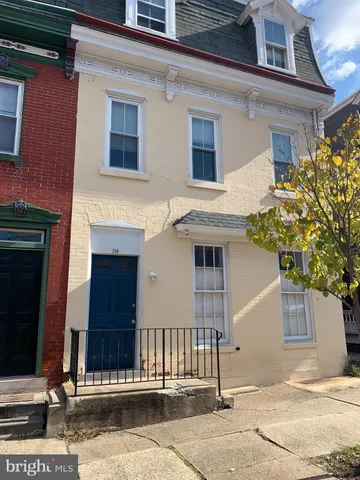 a front view of a house with a garage