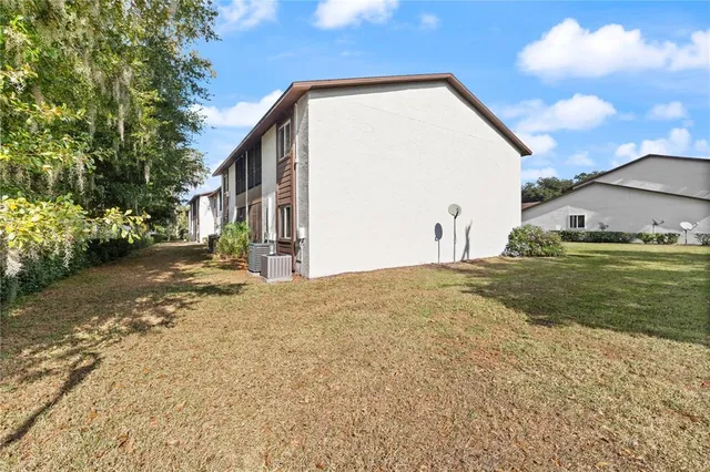 aerial view of a house with a yard