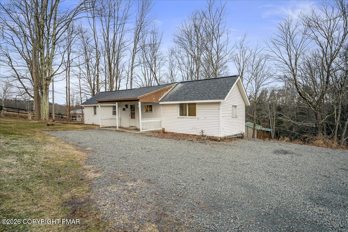 1191 Aberdeen Road Moscow, PA 18444 - Photo 18 of 19 a house with trees in front of it